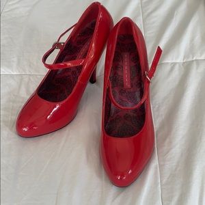 Red patent high heels.